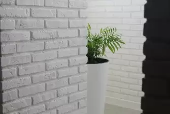 Облицовка П-образного балкона искусственным камнем с утеплением