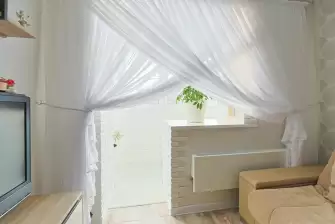 Облицовка П-образного балкона искусственным камнем с утеплением